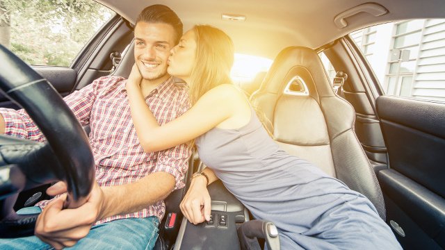 Woman Kissing Man In Car
